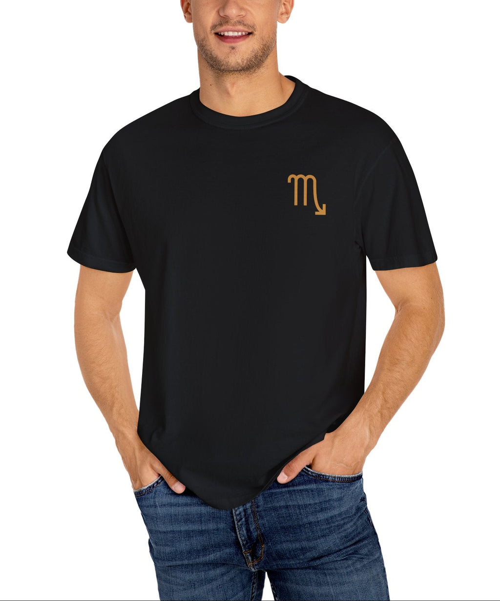 Man wearing a black t-shirt with a gold Scorpio symbol on a white background