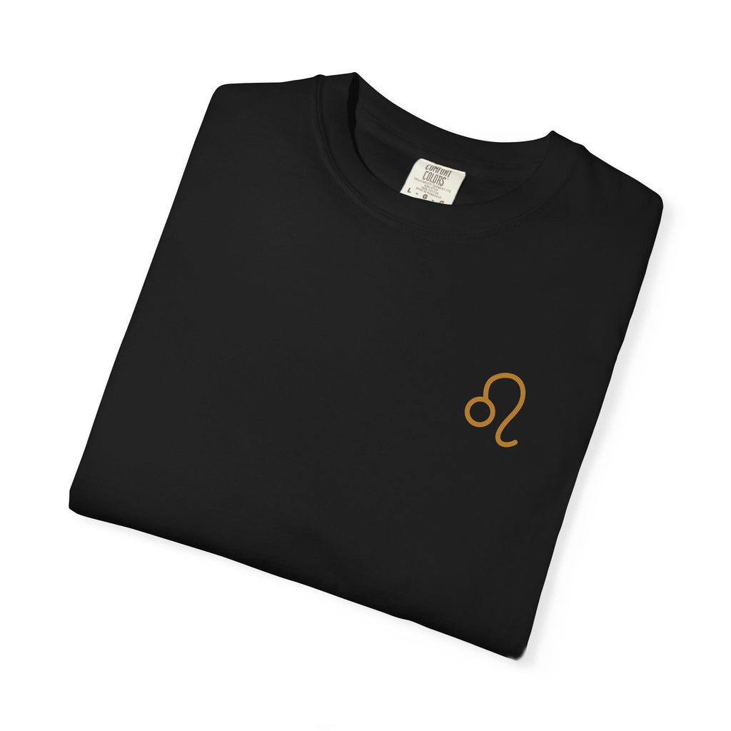 Folded black t-shirt with a yellow logo on a white background