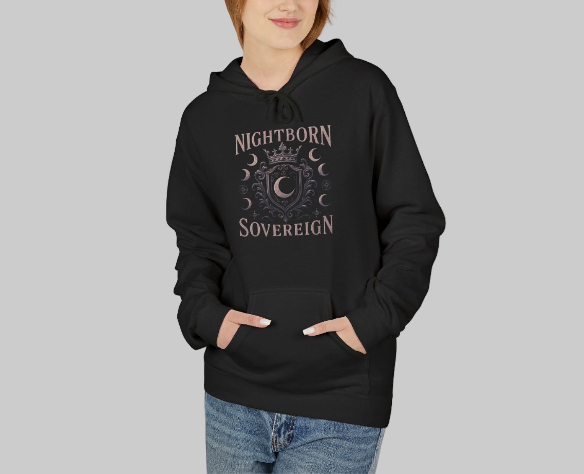 Person wearing a black hoodie with 'Nightrborn Sovereign' text and design on a white background