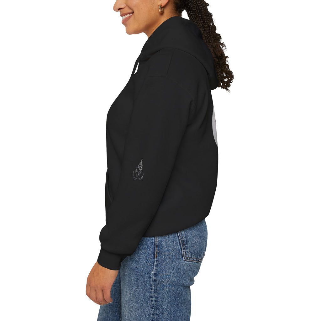 Person wearing a black jacket with a logo on a white background
