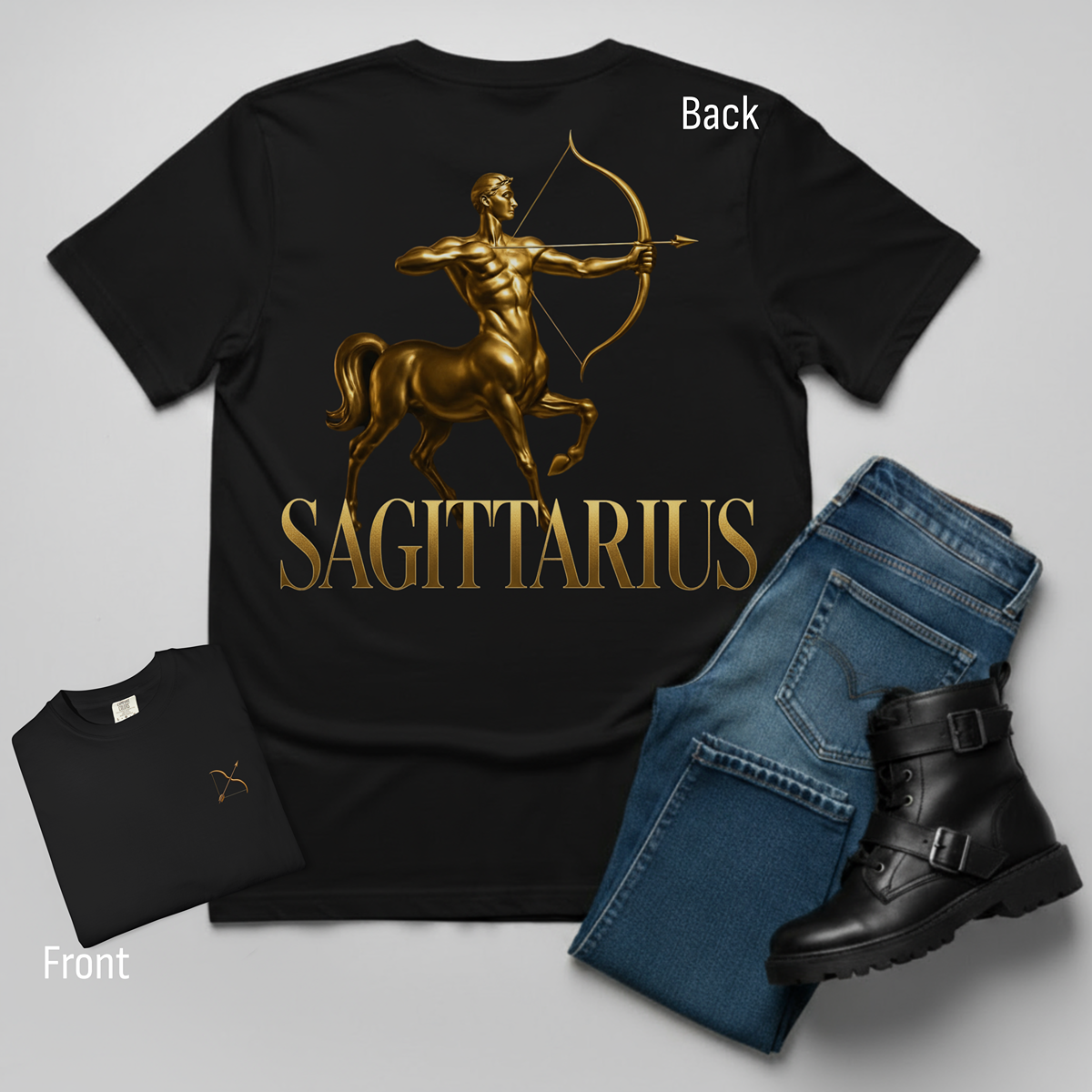 Black t-shirt with gold Sagittarius design, paired with blue jeans and black boots on a gray background.