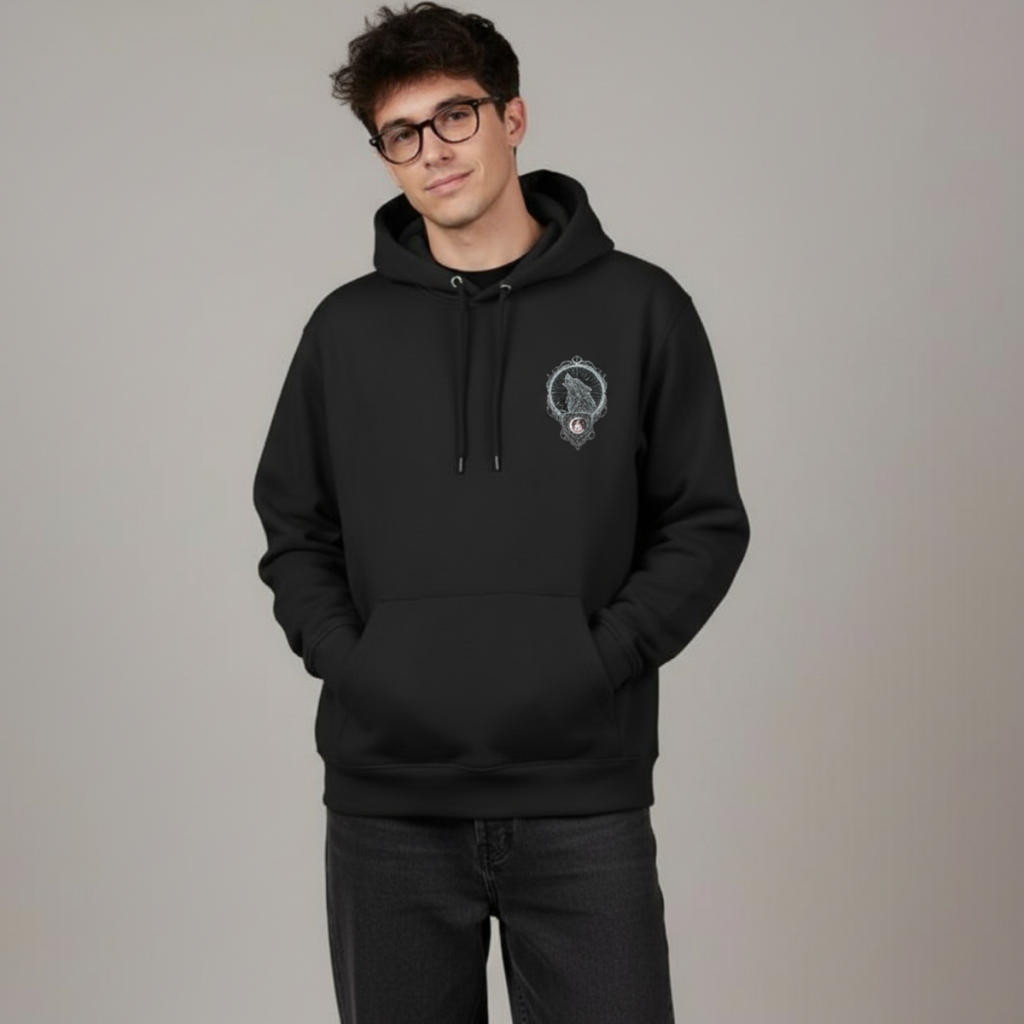 Person wearing a black hoodie with a logo on a gray background