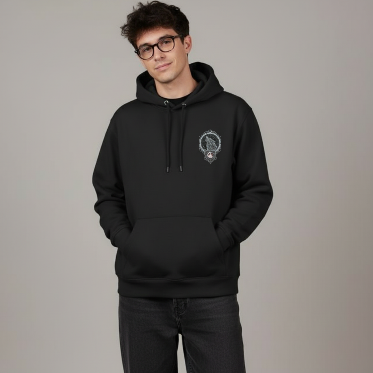 Person wearing a black hoodie with a logo on a gray background