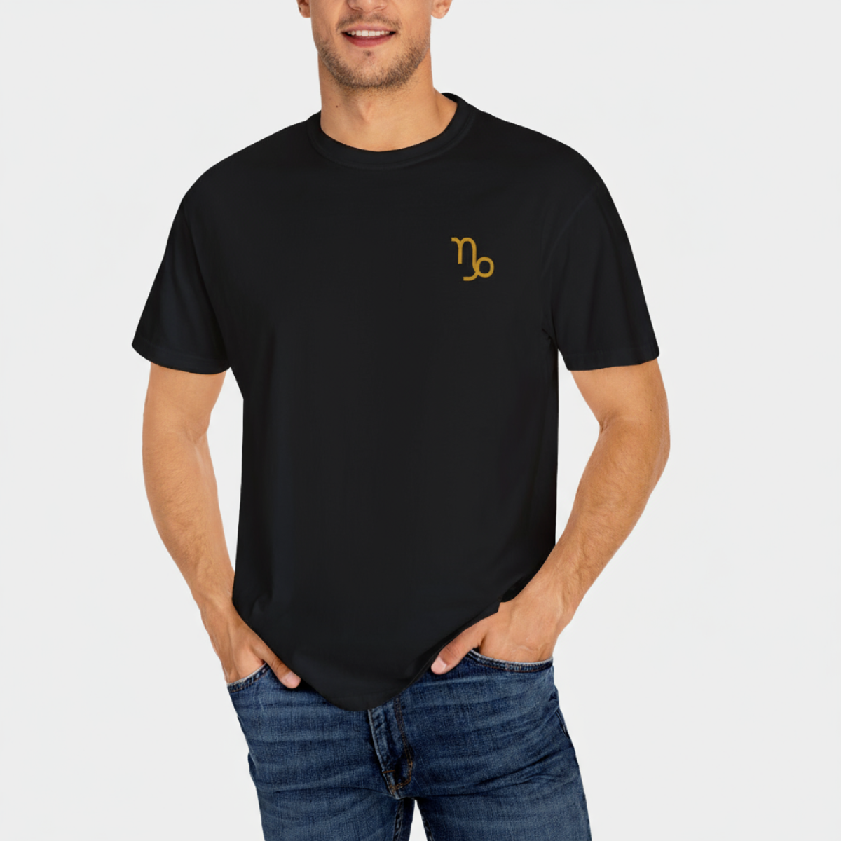 Person wearing a black t-shirt with a gold symbol on a white background