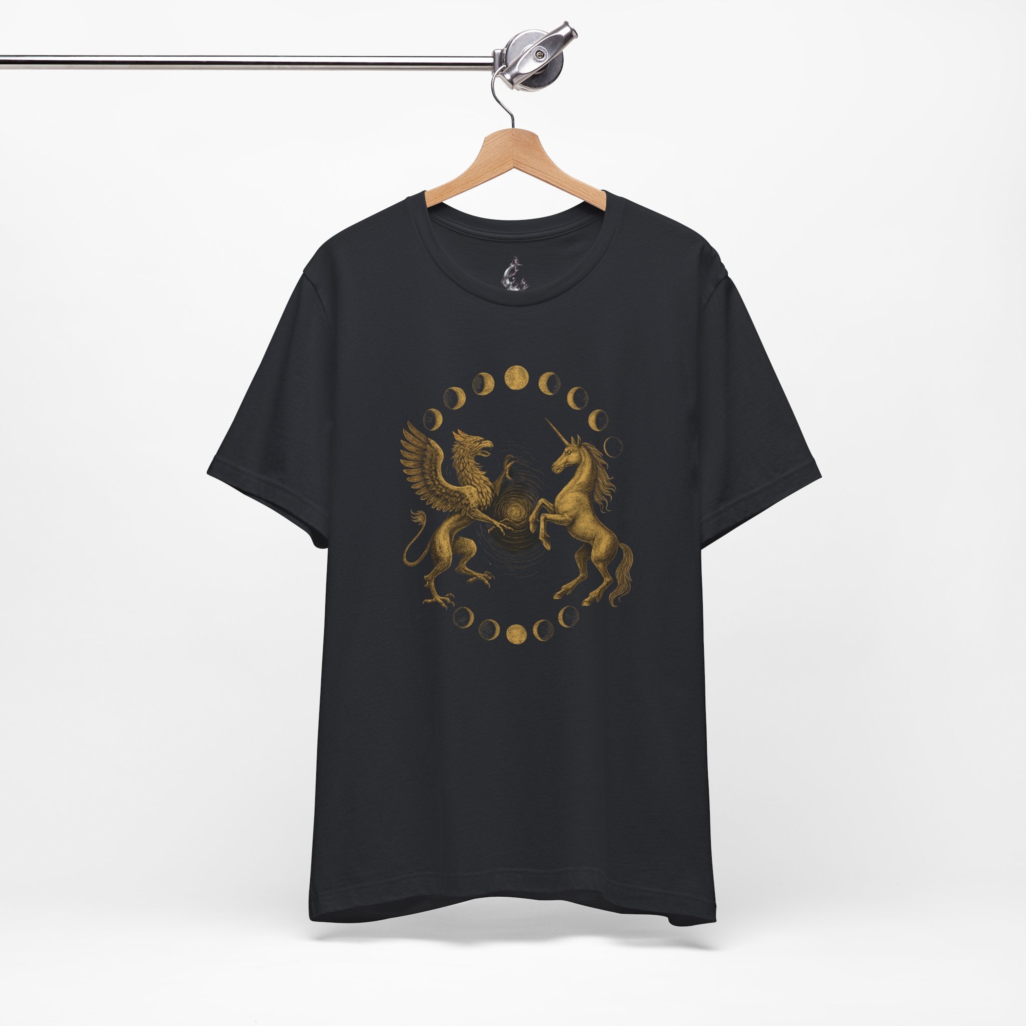 Black t-shirt with gold unicorn and dragon design on a hanger against a white background