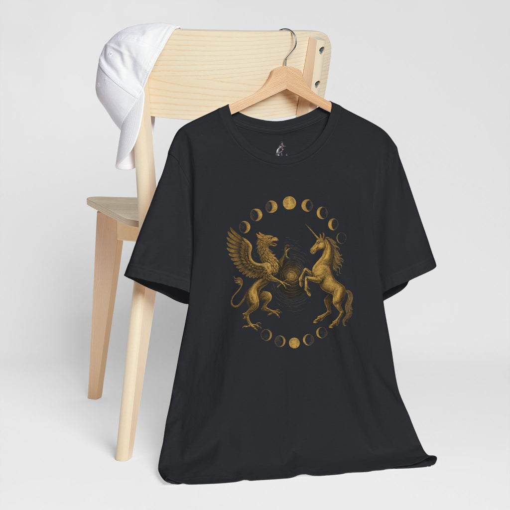 Black t-shirt with gold graphic design on a wooden chair against a white background