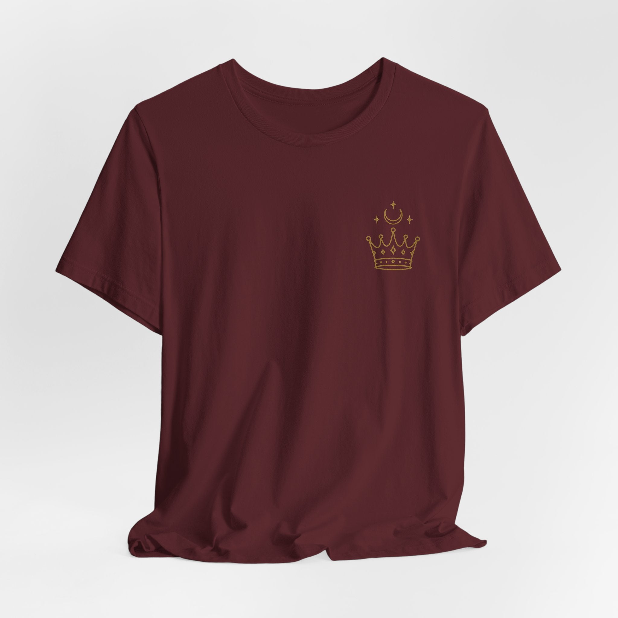 Maroon t-shirt with a gold crown logo on a light gray background