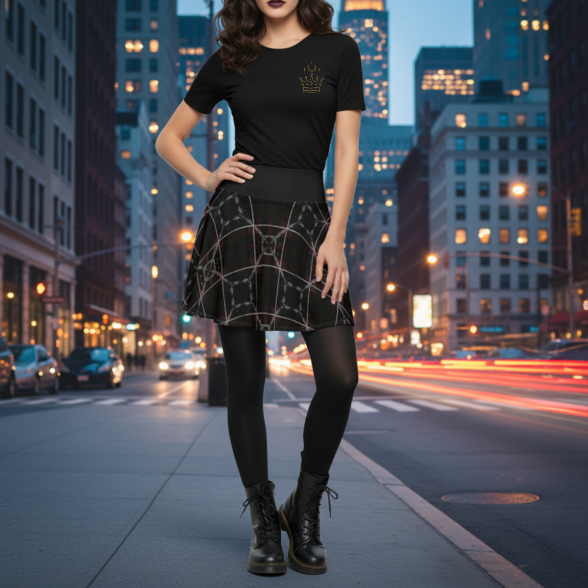 Woman wearing a Shadow Weave Gothic Plaid Skater Skirt with celestial feather-sigil pattern, styled with the Spin in the Dark pocket sigil t-shirt, black tights, and combat boots on a city street at night
