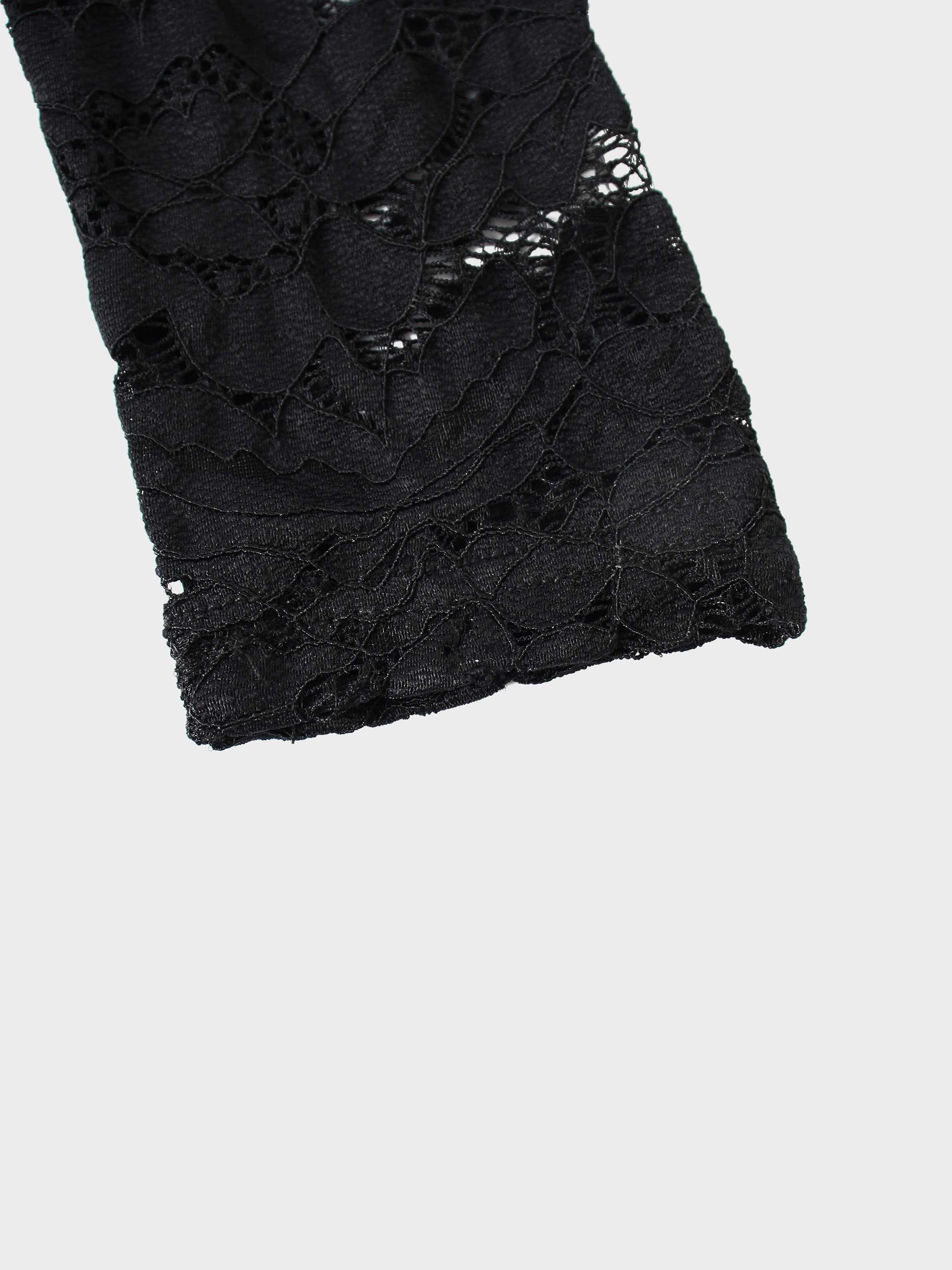 Black lace fabric on a white background